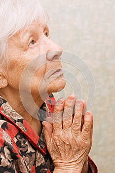 The old woman prays photo