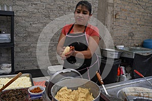 Old woman preparing a typical mexican food