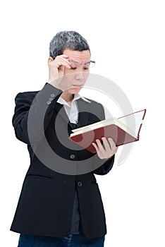 Old woman reading book having problem with her eyes