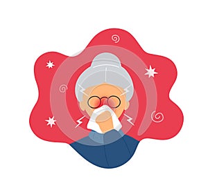 Old woman with rhinitis blowing nose into napkin