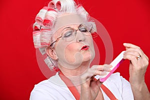 Old woman in rollers