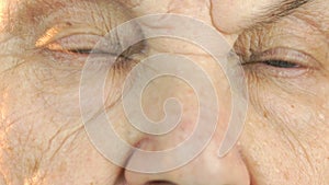Old woman`s face with disturbing look of face