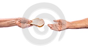 Old woman& x27;s hand holding piece of bread. Isolated on white. Hand with slice of whole wheat bread. Helping the