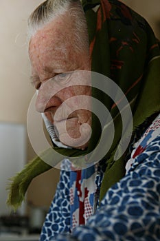 An old woman, senior, grand mother wearing the traditional middle european clothes