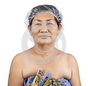 Old woman with a shower cap
