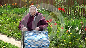 Old woman sitting in a wheelchair looking sad and worried. depression, healthcare and caring for the elderly