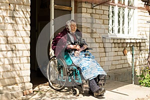 Old woman sitting in a wheelchair looking sad and worried. depression, healthcare and caring for the elderly