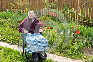Old woman sitting in a wheelchair looking sad and worried. depression, healthcare and caring for the elderly