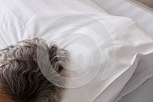 Old woman sleep on the bed in hospital