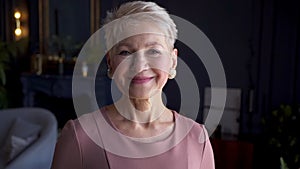 Old woman stand in stylish fashionable home interior portrait Akspb. 50s 60s Senior female happy