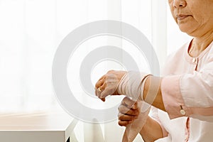 Old woman suffering from wrist hand pain, health problem concept