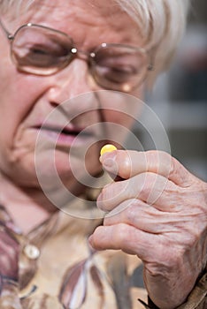 Old woman taking medication