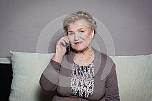 Old woman talking on the phone