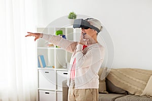 Old woman in virtual reality headset or 3d glasses