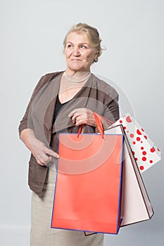 An old woman whith shopping bags