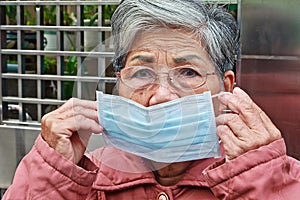 Old woman who wearing mask