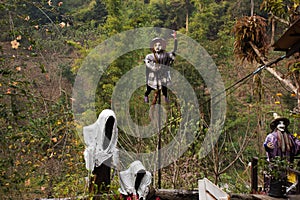 Old woman witch figurine and haunted house cafe coffee shop in garden outdoor on forest mountain at pai city hill valley in Mae