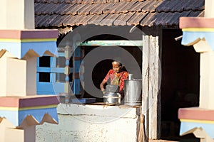 Old woman working at home