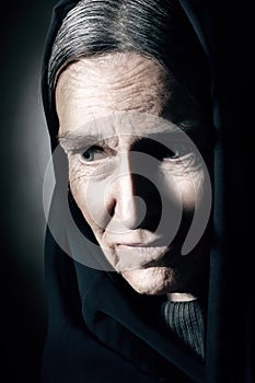 Old woman wrinkled face. Sad senior woman