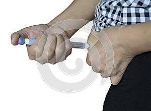 Old women diabetes patient using insulin injection pen in abdomen area on white background isolate