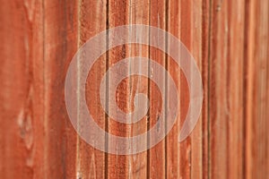 Old wood background with shabby red paint.close-up