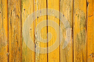 Old wood background with shabby yellow paint.close-up