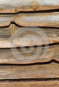 Old wood boards used as house siding in the early morning light