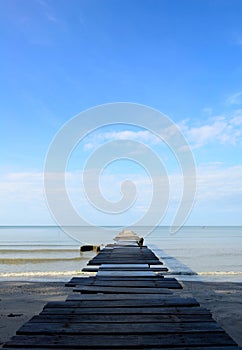 Old wood bridge on the beach