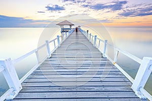 Old wood bridge pier  against beautiful sunset sky use for natural background ,backdrop and multipurpose sea scene