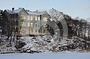 Old wood building in Helsinki, Finland. Winter scene