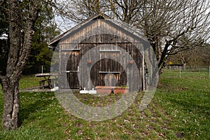 Old wood cabin on a meadow