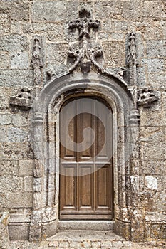 Old wood decorative doors in Lampaul Guimiliau - France