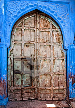 Old wood door with blue wall