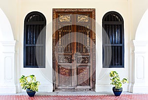 Old wood door with Chino-Portuguese style, Phuket, Thailand