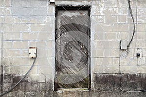 Old wood door concrete alley warehouse building abandoned