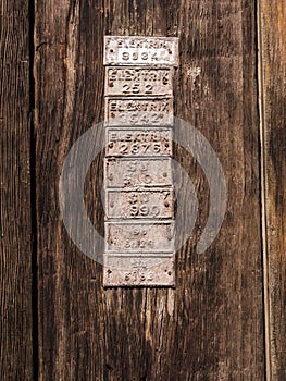 Old Wood Door Detail with Plates on It