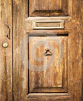 Old wood door with postbox