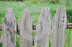 Old wood fence and grass in background