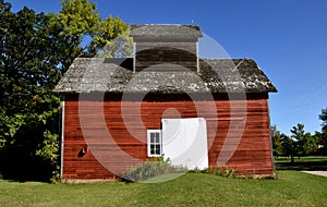 Old wood granary with an air vent on the roof