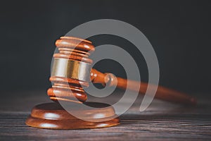 Old wood Judge hammer with law book on the table wood background, Used for adjudication and Justice