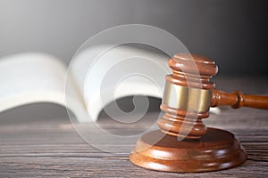 Old wood Judge hammer with law book on the table wood background, Used for adjudication and Justice