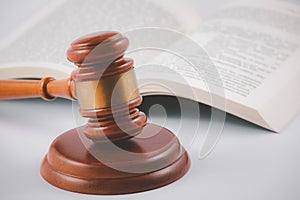 Old wood Judge hammer with law book on the table wood background, Used for adjudication and Justice photo