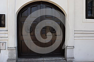 Old wood and messing door with two door knockers