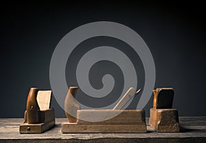 Old wood plane on rustic plank