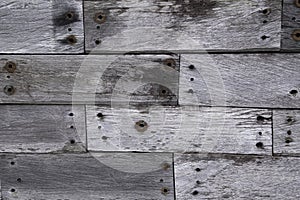 Old wood planks with nail in interlocking pattern background and wallpaper texture