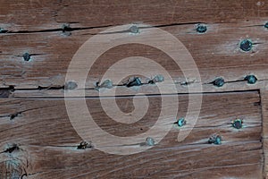 Old wood planks nailed with hand made nails, verdigris patina, creative copy space background craftsmanship photo