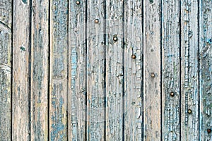 Old wood planks with paint peeling off.