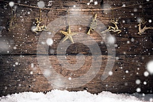Old wood texture gold star , gold reindeer and decoration with snow flakes christmas background