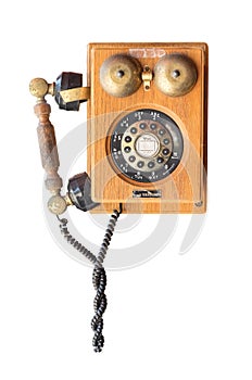 Old wood vintage telephone isolated on white background