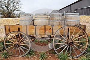 Old wood wagon with wine barrels loaded in a carriage nearby Fredericksburg, Texas